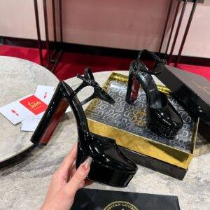 Christian Louboutin Maison Lou Pump; high heels; 13cm; black; avant-garde design; red sole.
